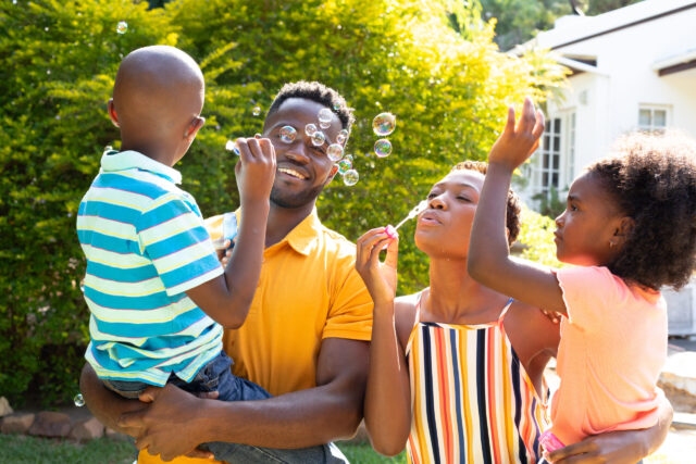 African American family spending time together in their garden.