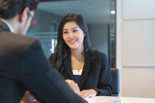 Asian woman answering question interview during job application.