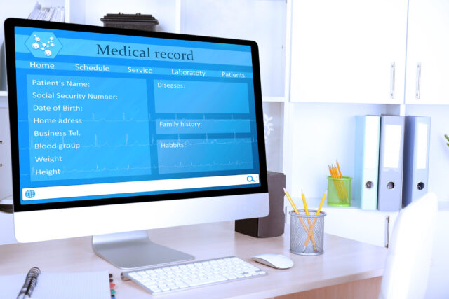 Doctor workplace medical records on computer